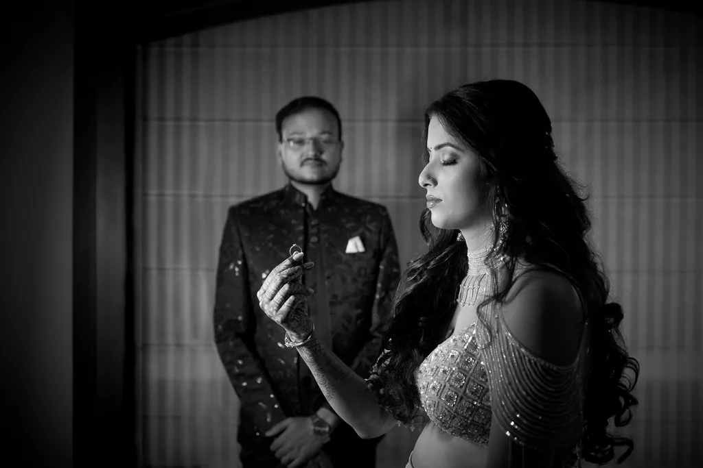 Black and white ring reveal as the bride-to-be holds up her engagement ring at The Pinnacle Inn Sarnath Varanasi by The WeddingShoot